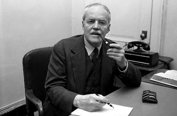 Alan Dulles posing with pen and pipe